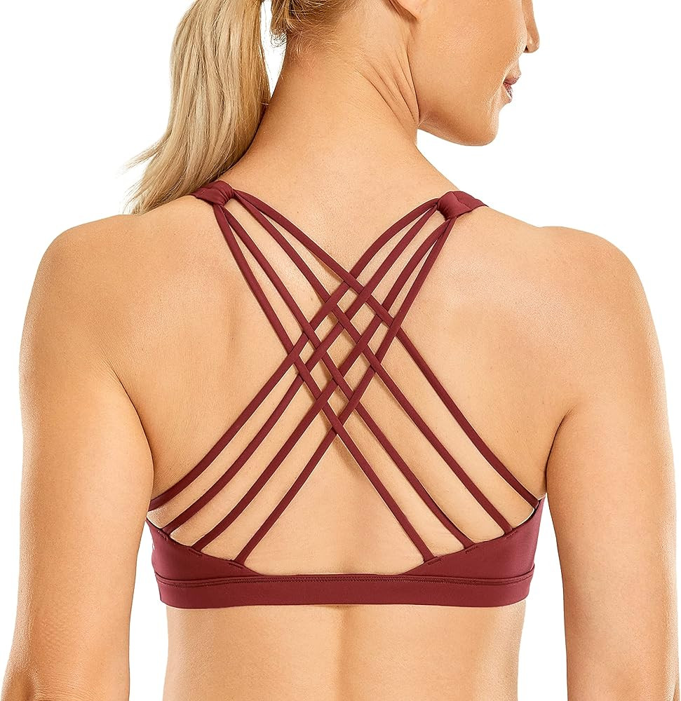 CRZ YOGA Strappy Sports Bras for Women - Criss Cross Back Sexy Wireless Padded Yoga Bra Cute Work... | Amazon (US)