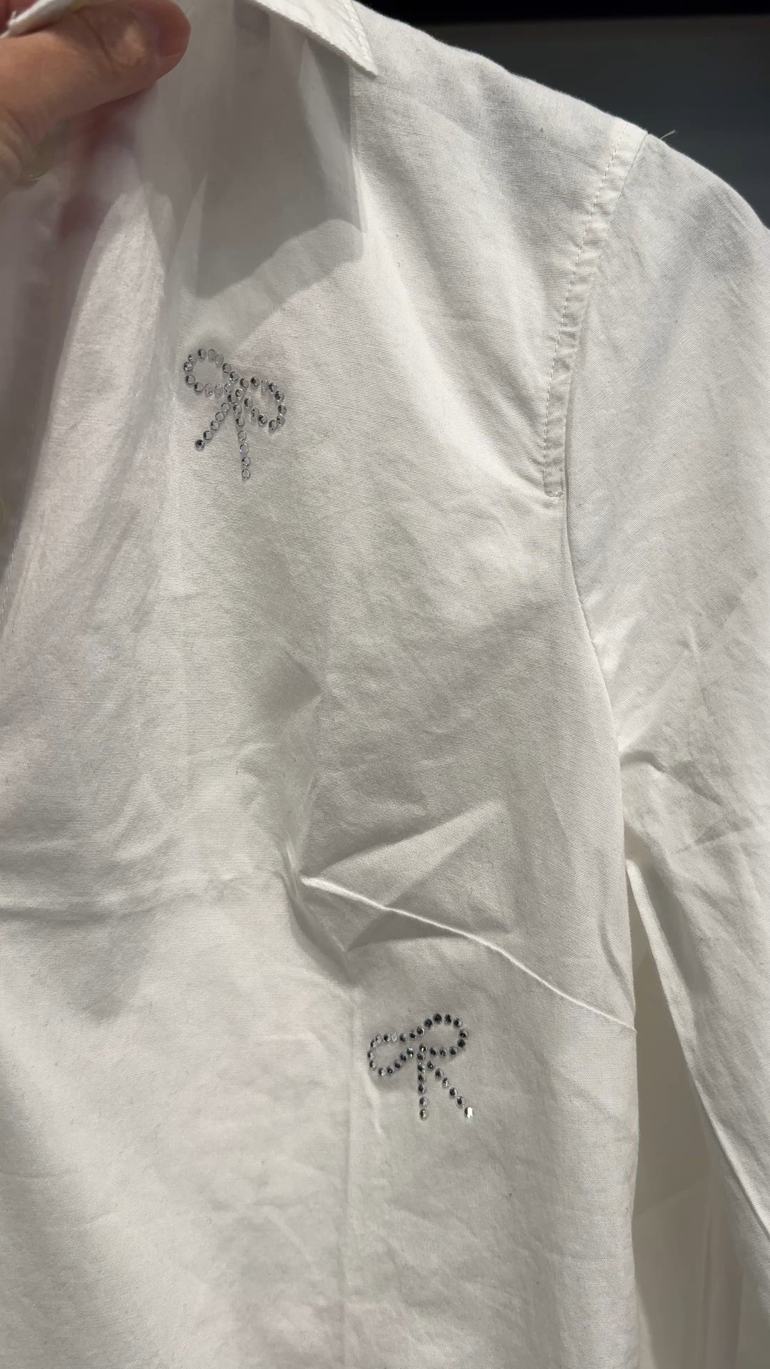 Casual holiday top. Cotton button down with bow embellishments. 
Wear casually with jeans or dress up with velvet or corduroy pants  

#LTKFindsUnder50 #LTKOver40 #LTKHoliday