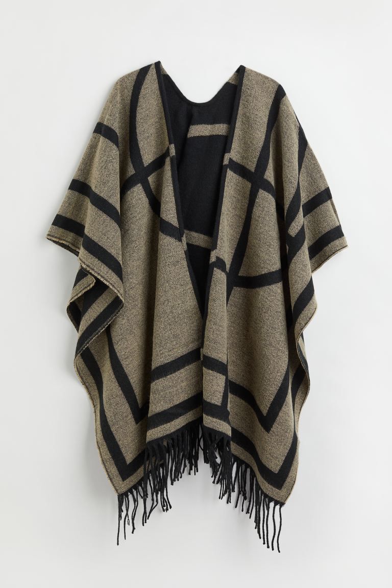 Poncho in patterned, woven fabric. Open front and fringe at hem. Length at back 25 1/2 in. | H&M (US + CA)