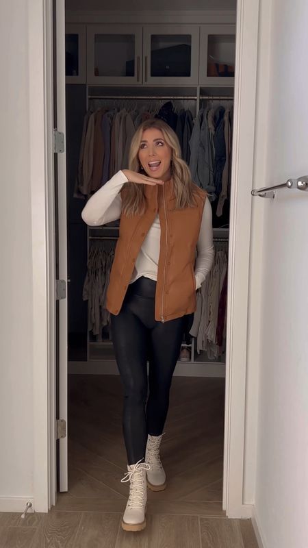 Puffer vest, long sleeve white top, spanx faux leather leggings all run tts. Boots are yellowbox and code MELISSAGFW22 is 20% off on their site  

#LTKunder100 #LTKstyletip #LTKshoecrush