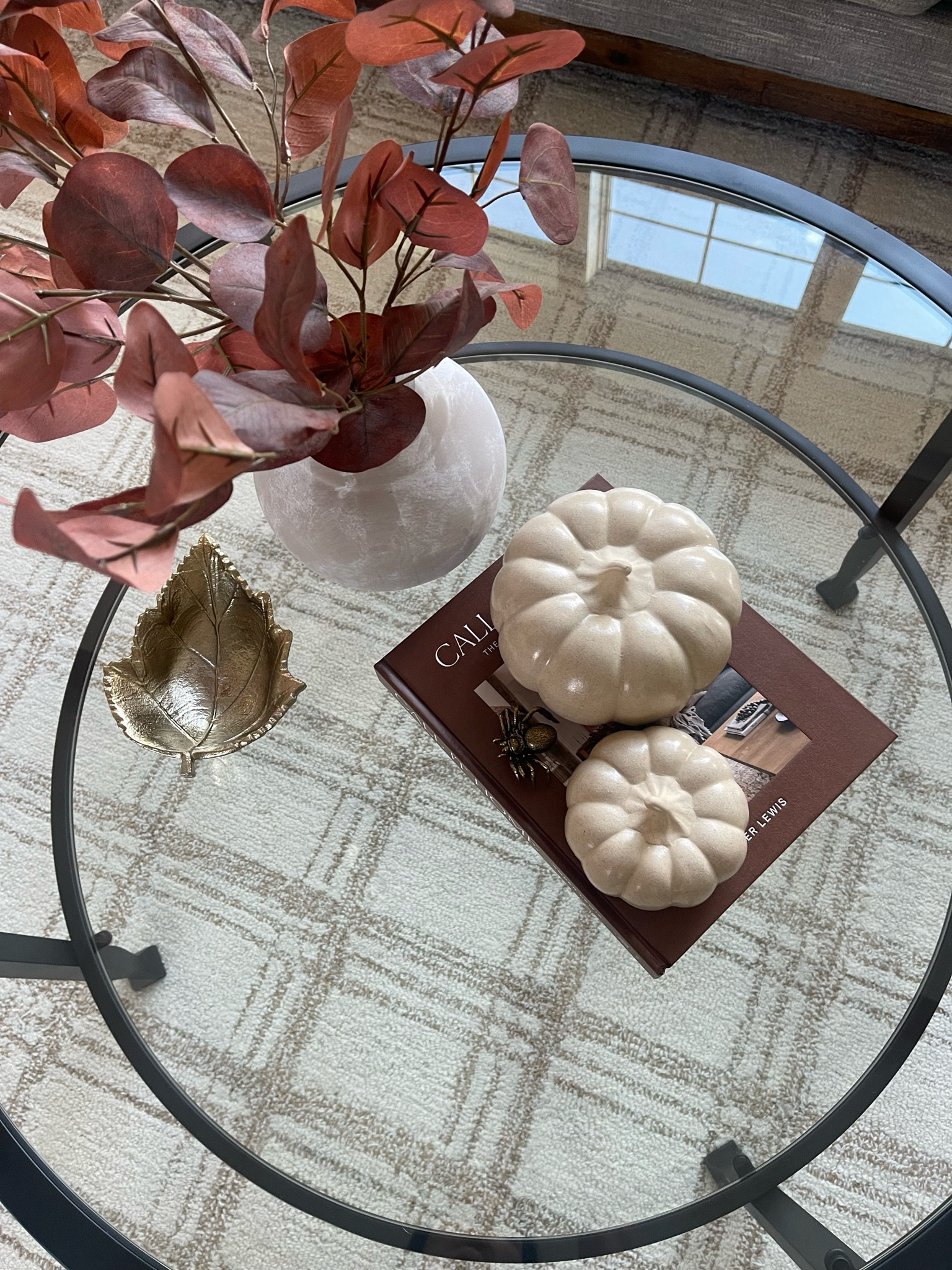 Fall home decor and coffee table styling // faux plants // coffee table books // Pottery Barn Tanner Coffee Table // Black Coffee Table // Chris Loves Julia Loloi Polly Rug // Neutral Area Rug 

#LTKSeasonal #LTKHome #LTKFindsUnder50