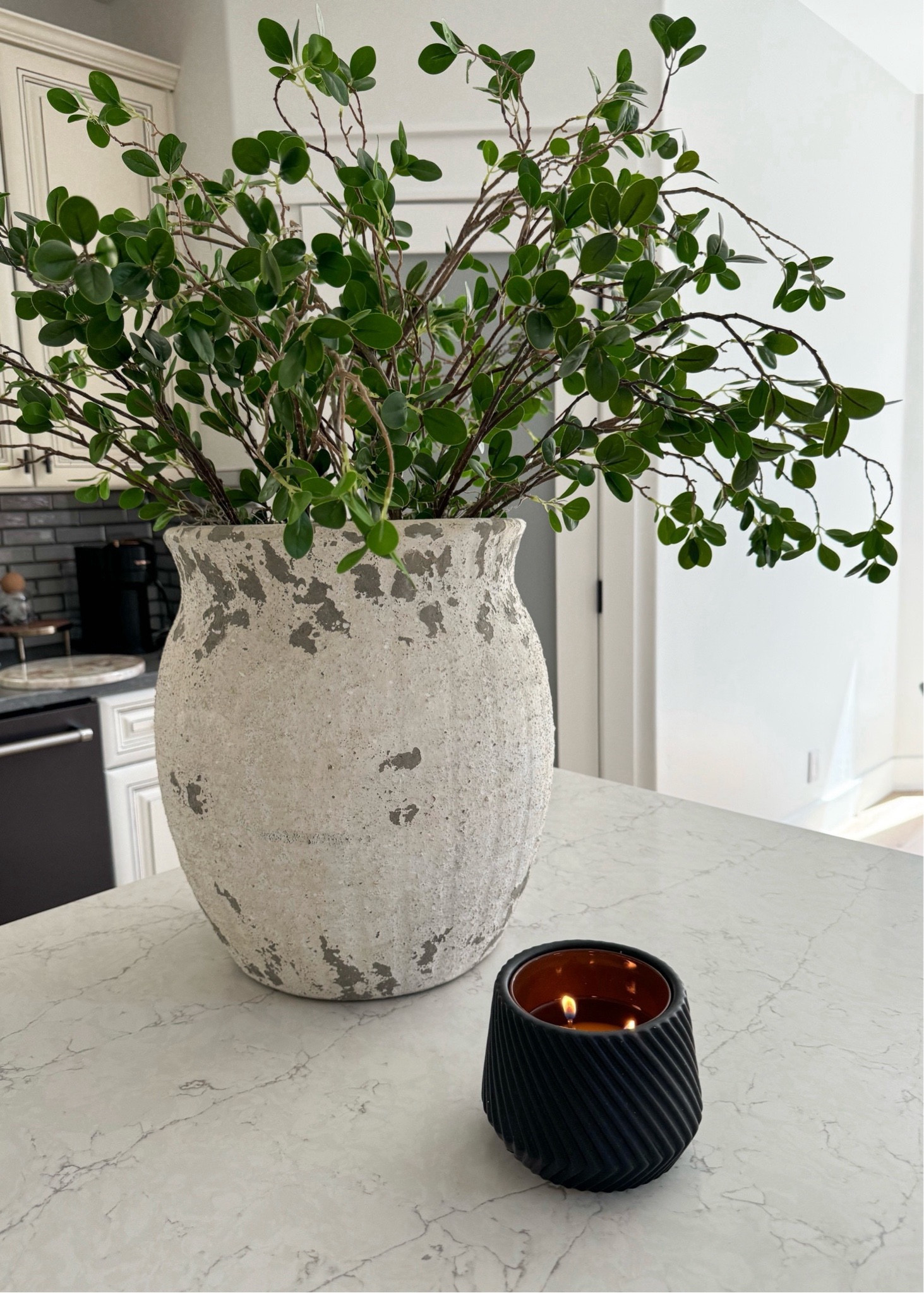 This $6 planter doubles as the perfect candle holder …
Antique vase and amazon stems 
Kitchen home decor 

#LTKFindsUnder50 #LTKHome #LTKFallSale