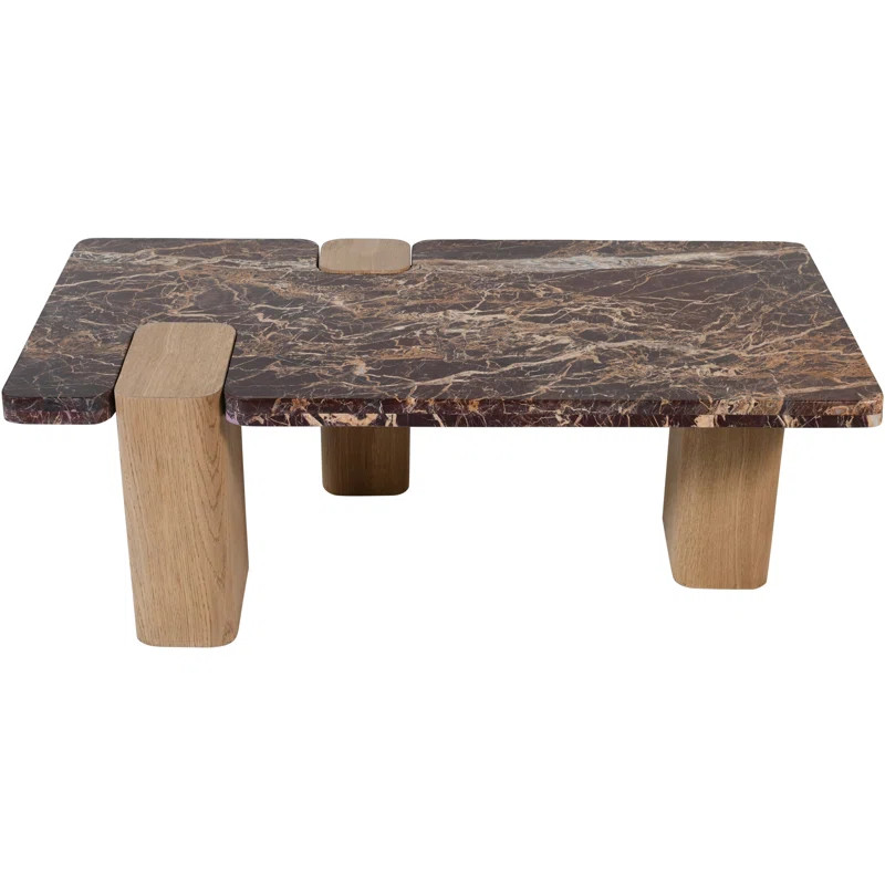 A bold fusion of rich materials, the genuine marble top and wood base coffee table showcases -col... | Wayfair North America