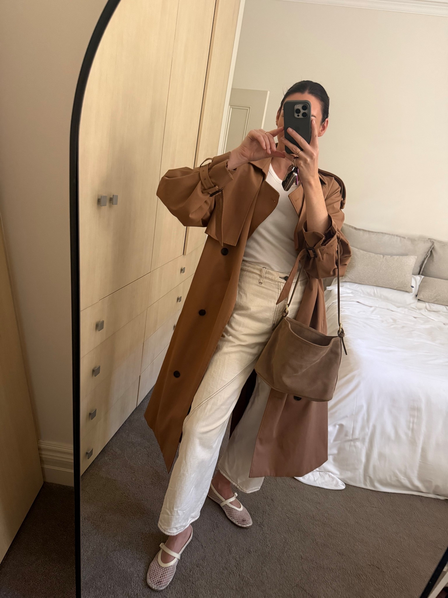 Everyday neutral outfit 
Toffee oversized trench coat by Camilla and Marc 
White high waisted denim 
Beige suede bag 
White mesh ballet flats 

#LTKaustralia #LTKautumn #LTKstyletip