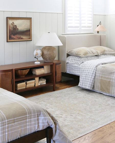 This is the current bedroom styling of the boys’ room. 
I replaced the wall mount headboards with upholstered wing back wood beds. The quilt and sheet sets are from Gap/Walmart. I kept  the wood and cane TV console but added the famous McGee and Co Decker ceramic lamp 

#LTKstyletip #LTKhome #LTKFind