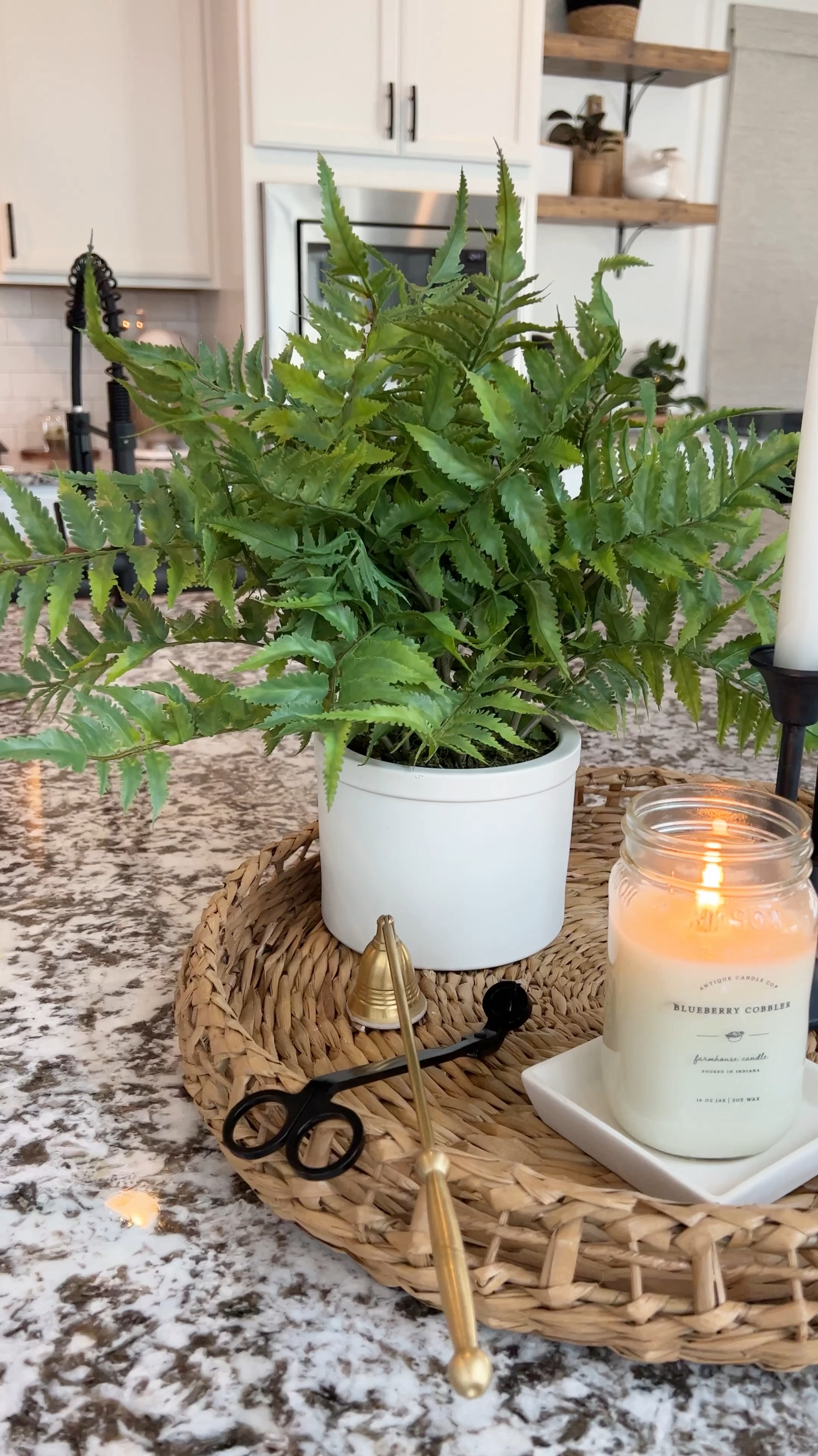 Kitchen centerpiece, blueberry cobbler candle, farmhouse candle, Target home finds, wicker tray, faux fern plant, candle snuffer. 

#LTKFind #LTKhome #LTKunder50