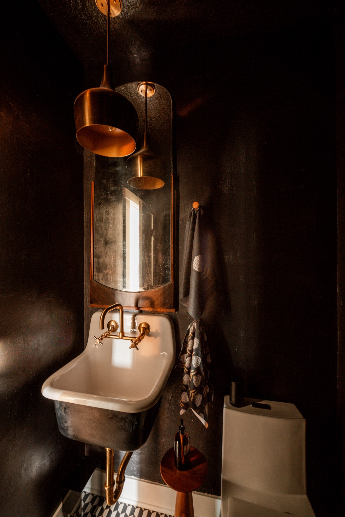 Moody black powder bath:
Complete with cast-iron farmhouse, sink, vintage mirror, brass, lighting, and faucet, modern toilet, and wooden hooks.

The look is moody yet warm yet minimal and perfect for any style really ! 

Follow along for more . 🖤🖤🖤

#LTKSaleAlert #LTKHome