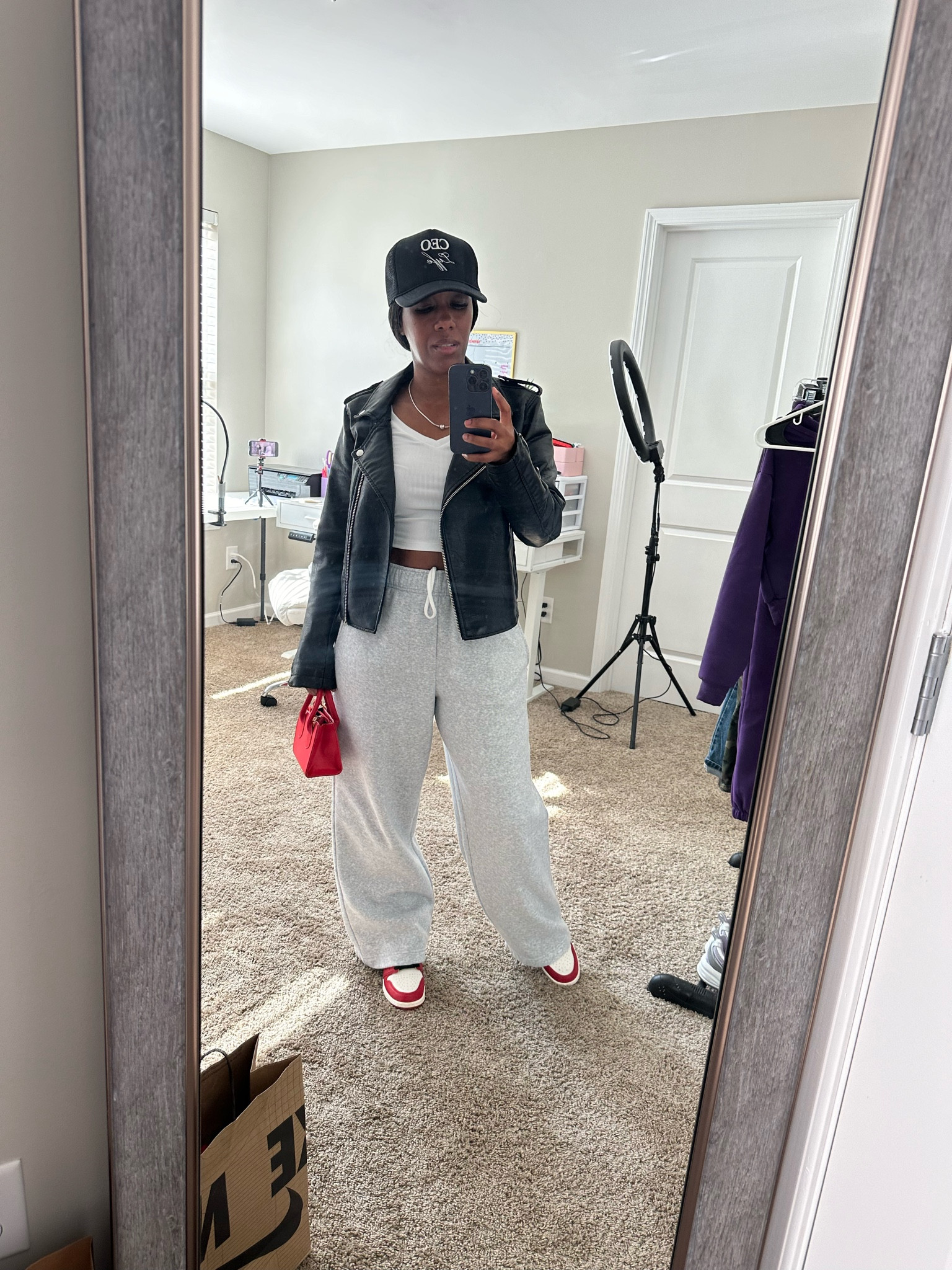 Casual outfit of the day.

I’m wearing a black trucker hat, black faux leather jacket, white ribbed crop top, grey sweatpants, red mini purse, and Jordan 1 lost and found sneakers.


#LTKOver40 #LTKSeasonal #LTKStyleTip