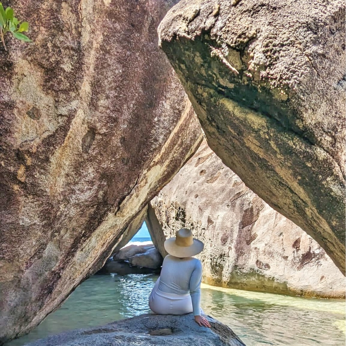 Just a girl, staring into a cave, wondering if she’s going to slip on the rock when she stands up from this picture. 