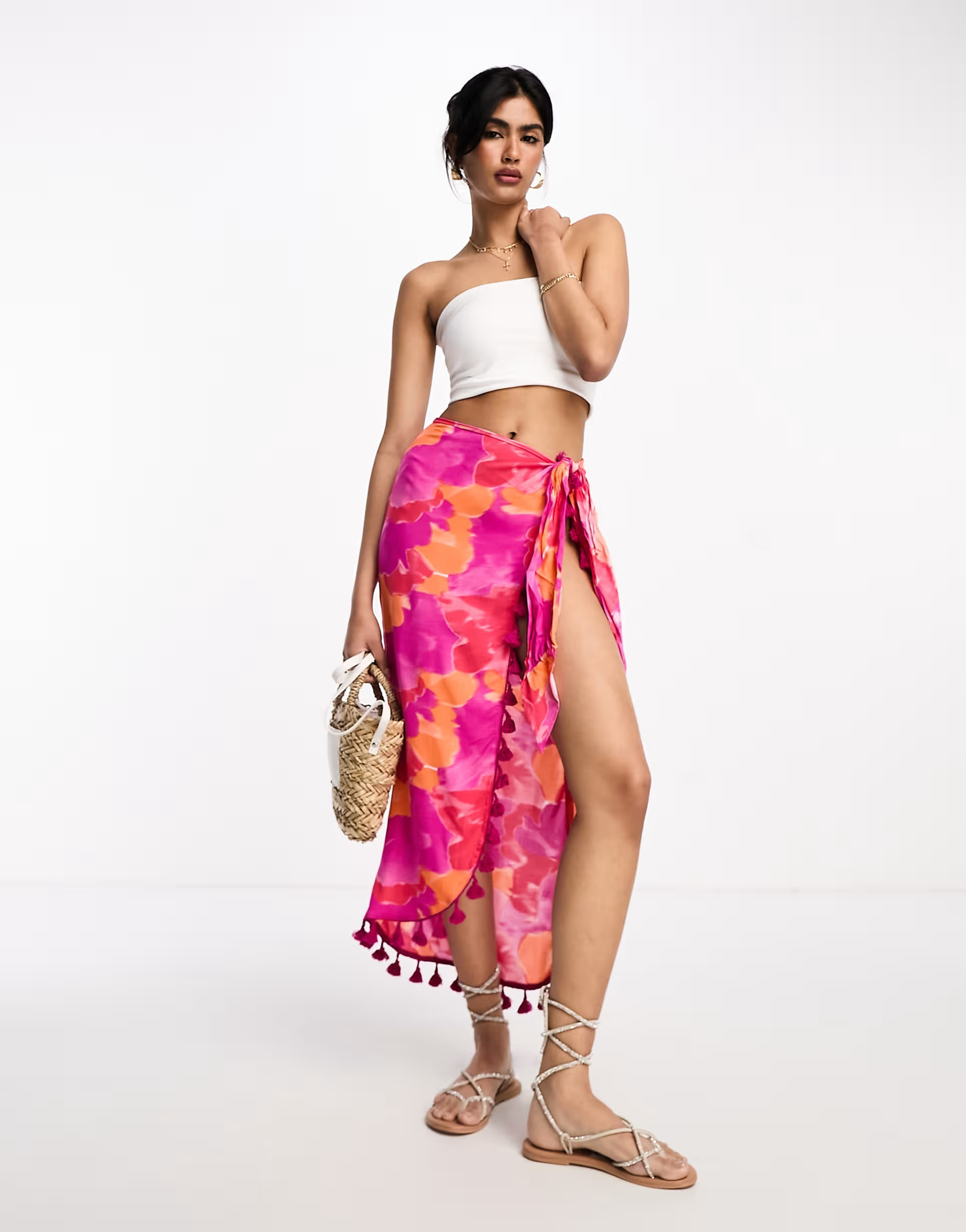 ASOS DESIGN sarong midi skirt in bright blurred floral with tassels | ASOS (Global)