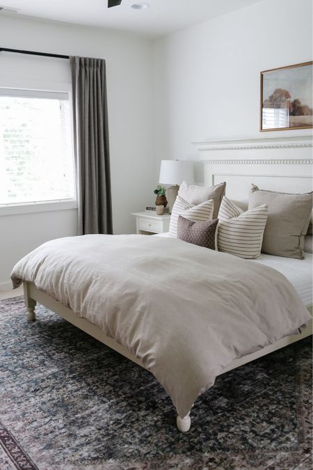 In our primary bedroom we have a Amber Lewis x Loloi area rug, JCPenney affordable duvet cover, gray Pottery Barn drapes  

#LTKhome #LTKstyletip #LTKFind