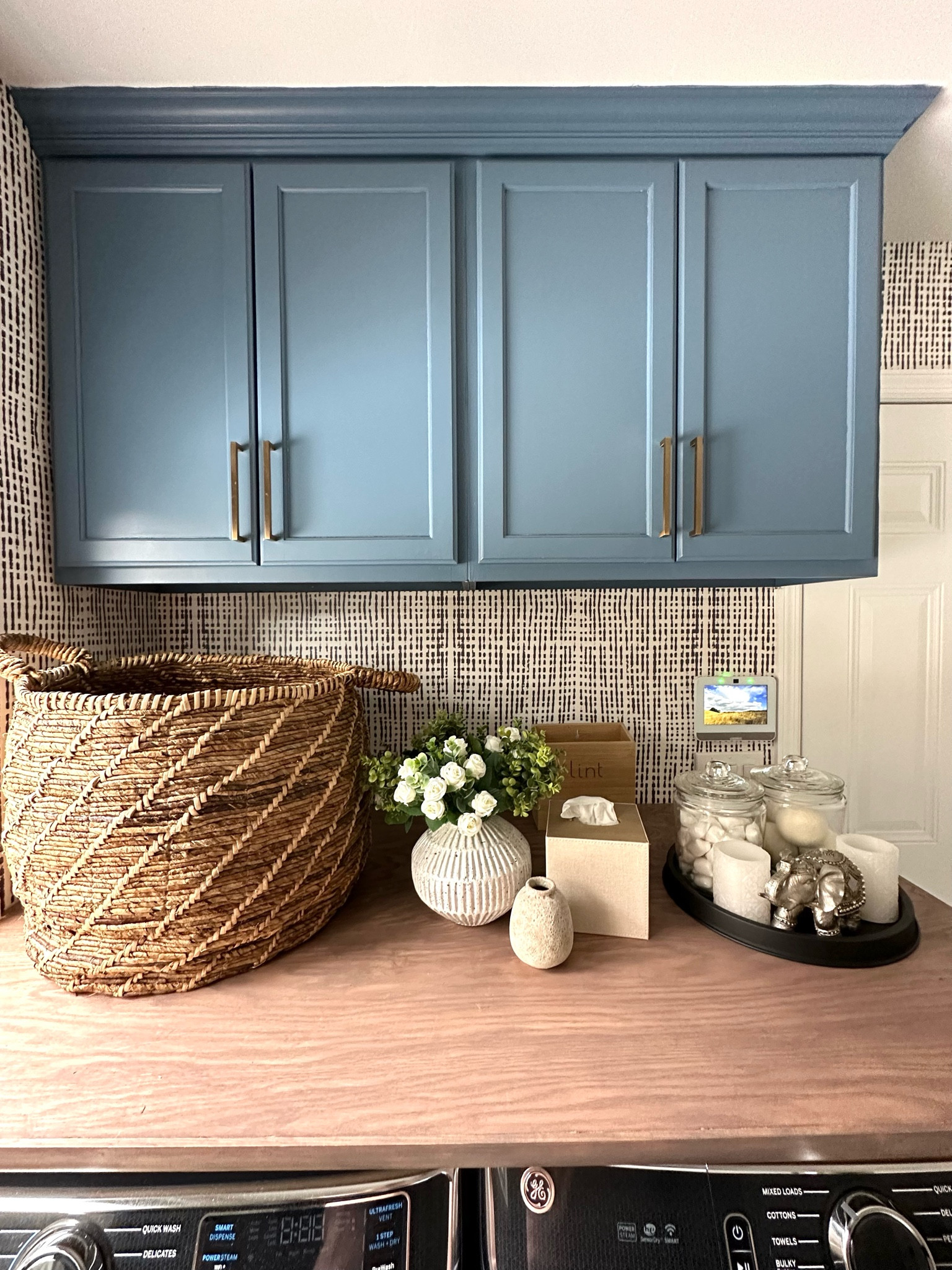 Laundry room decor. Wicker basket. Wicker hamper. Decorative vase. Rose stems. Floral stems. Cookie jar. Tissue box. Studio McGee. Amazon. Anthropologie. Decorative tray. Black decorative tray. Flameless candles. Magnetic lint bin. #LTKFind 

#LTKhome #LTKstyletip