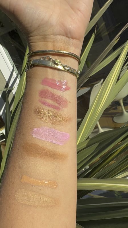 Sunlit swatches of some of my summer makeup on heavy rotation 🌞. 
Shade Specifics:
Foundation- 30W Golden Nude
Bronzer-Medina 
Blush-Bold Pink
Lip liner-Davy
Eyeshadow-Star Gold
Lipstick: Becky Sharp
Lip Gloss-Prima Donna
Setting Powder-Honey
Concealer-4.5
