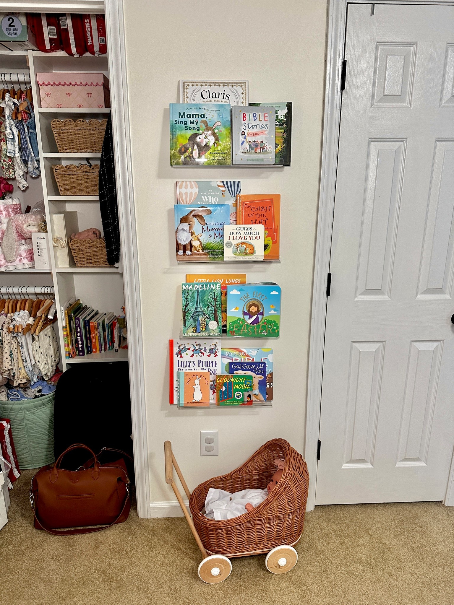 Baby girl nursery decor - clear acrylic book shelves, rattan doll stroller prom,  Mina baie diaper bag 

#LTKHome #LTKBaby