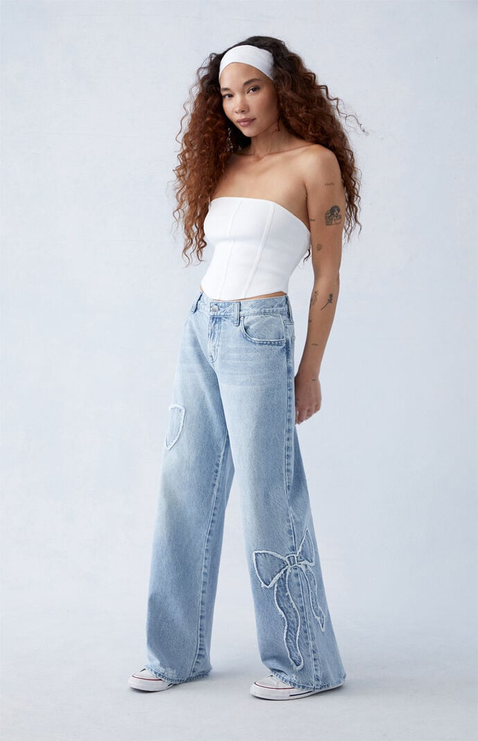 Women's Casey Light Indigo Bow Low Rise Baggy Jeans in Medium Indigo - Size 29 | PacSun