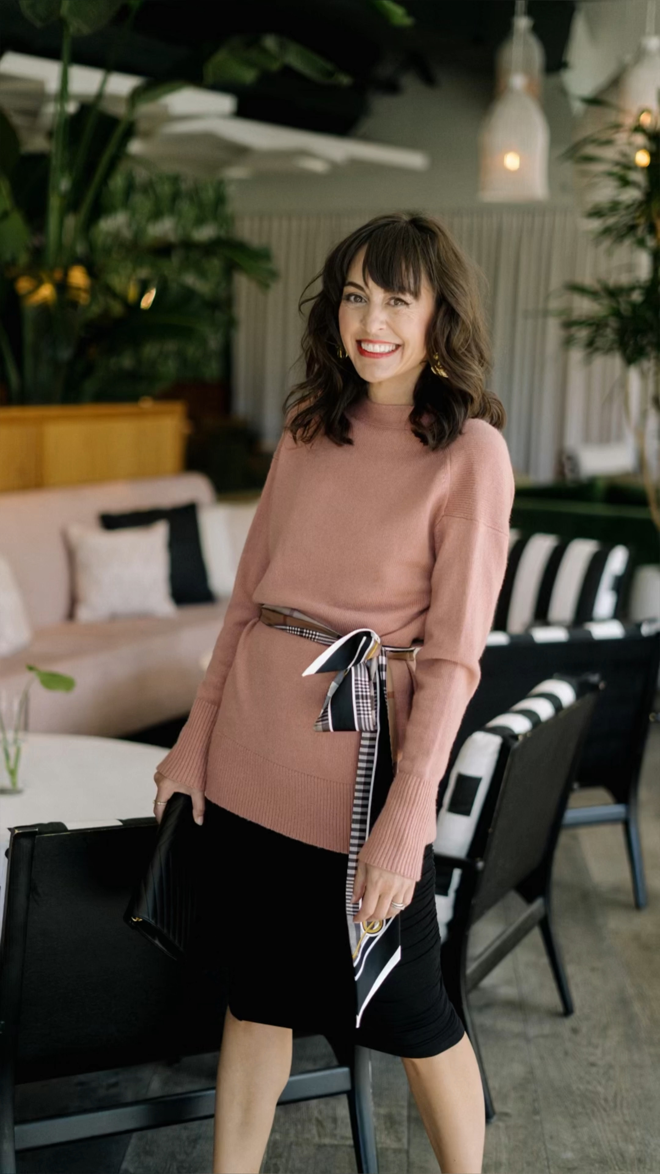 This extra long Burberry scarf is the best accessory to travel with. Not only do you get a designer accessory for under $220. You get so many accessories all in one. With so many ways to wear it you’ll see why I picked it as part of my new carry-on capsule wardrobe.