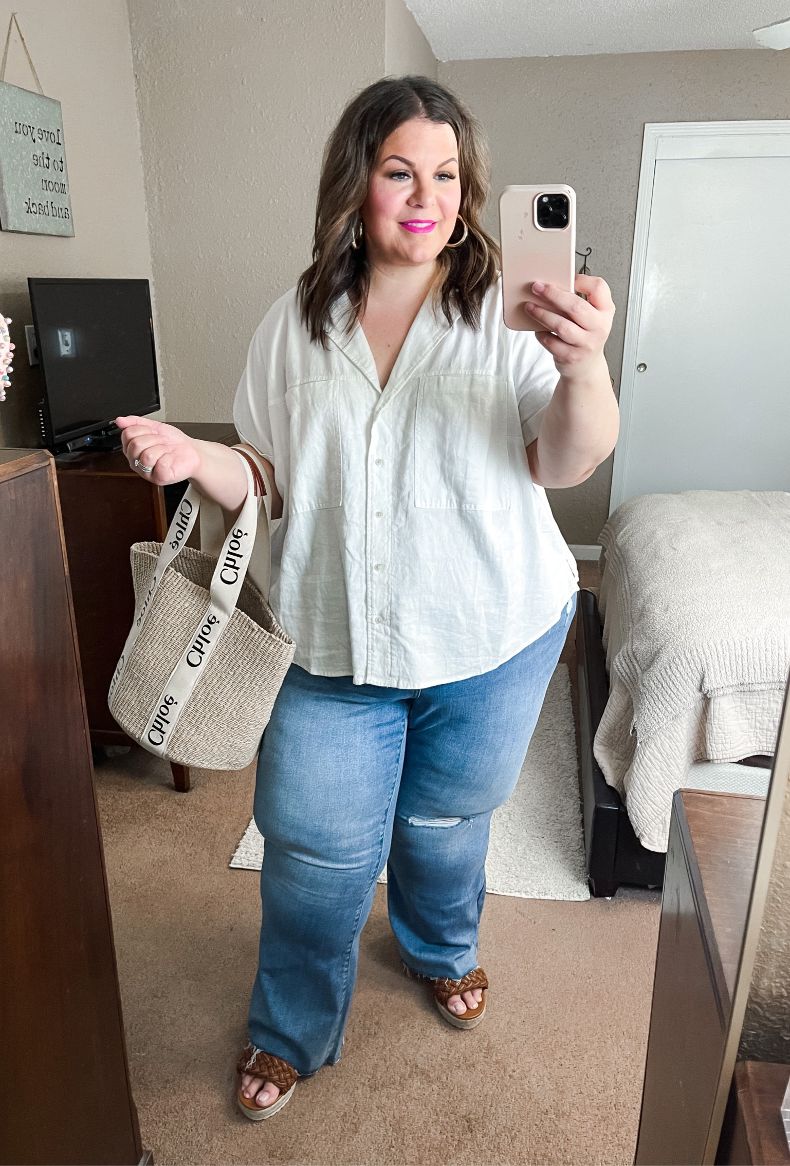 Plus size Target outfit! These plus size flare jeans have a tiny bit of distressing. Wearing them in a 26, true to size. Plus size linen top is a 3X and true to size. Wide width wedges in a 12. 

#LTKunder50 #LTKFind #LTKcurves