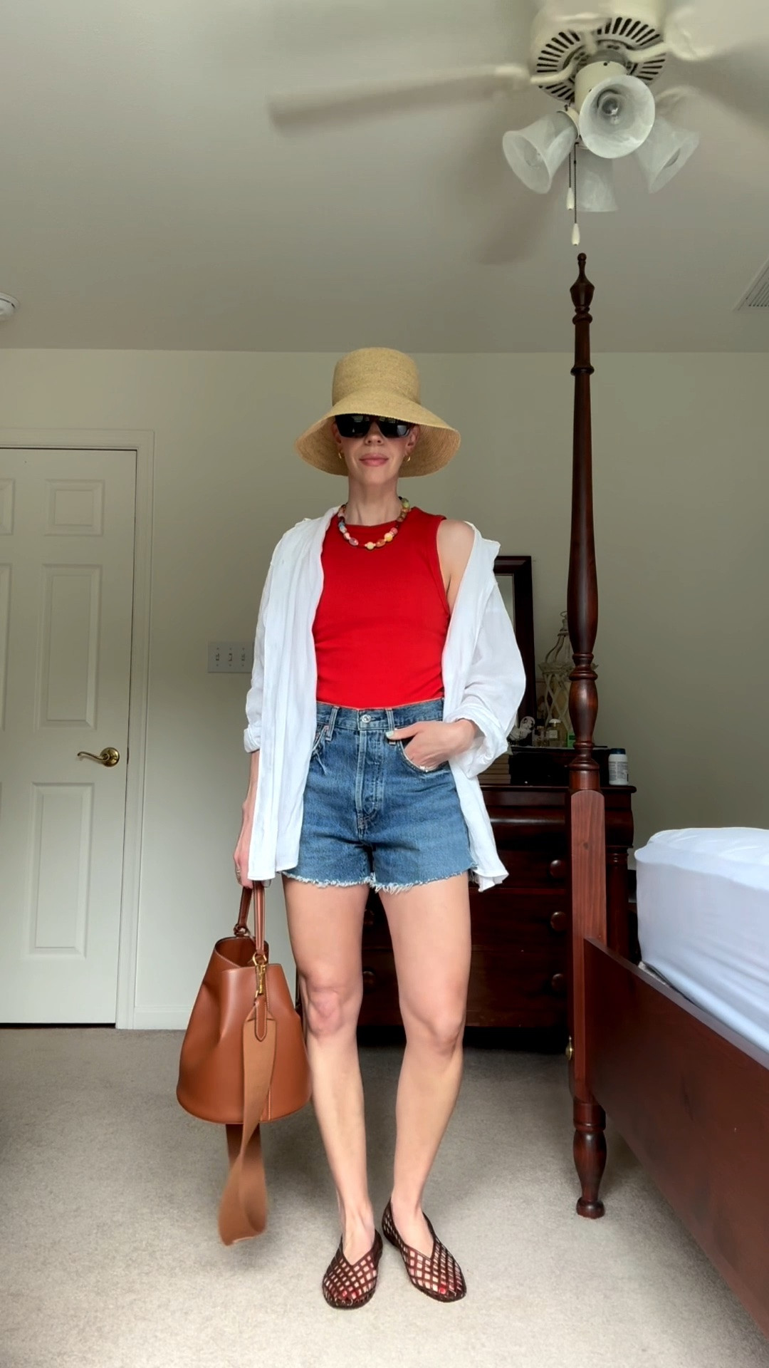 Casual summer outfit with red tank top, cutoff denim shorts, jelly shoes, @Janessa Leone straw bucket hat

#LTKSeasonal #LTKOver40 #LTKgrwm