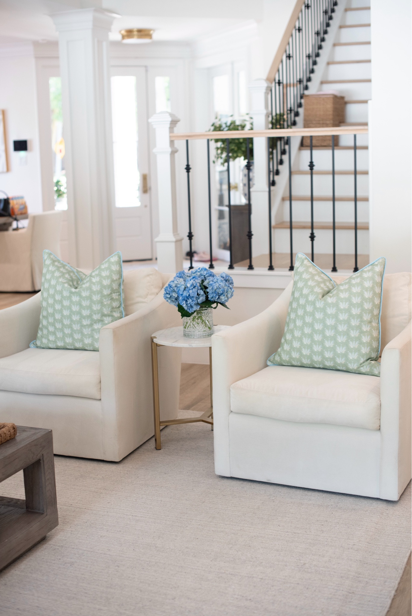 Living room seating area with velvet chairs and Spring pillows 

#LTKfamily #LTKSeasonal #LTKhome