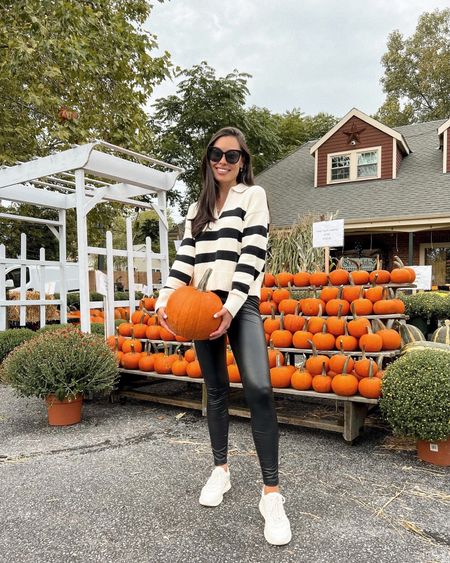 Kat Jamieson of With Love From Kat wears a stripe sweater and faux leather leggings. Fall style, casual outfit, sneakers. 

#LTKHalloween #LTKSeasonal