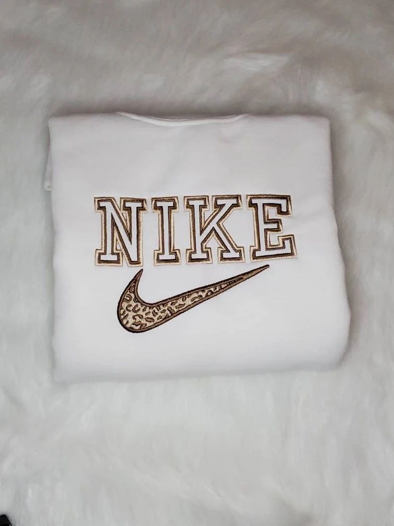 Read the full title
    Embroidered Nike inspired cheetah print design crewneck sweater. | Etsy (US)