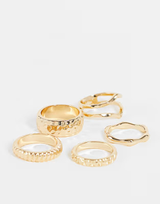 ASOS DESIGN pack of 5 rings in textured designs in gold tone  | ASOS | ASOS (Global)
