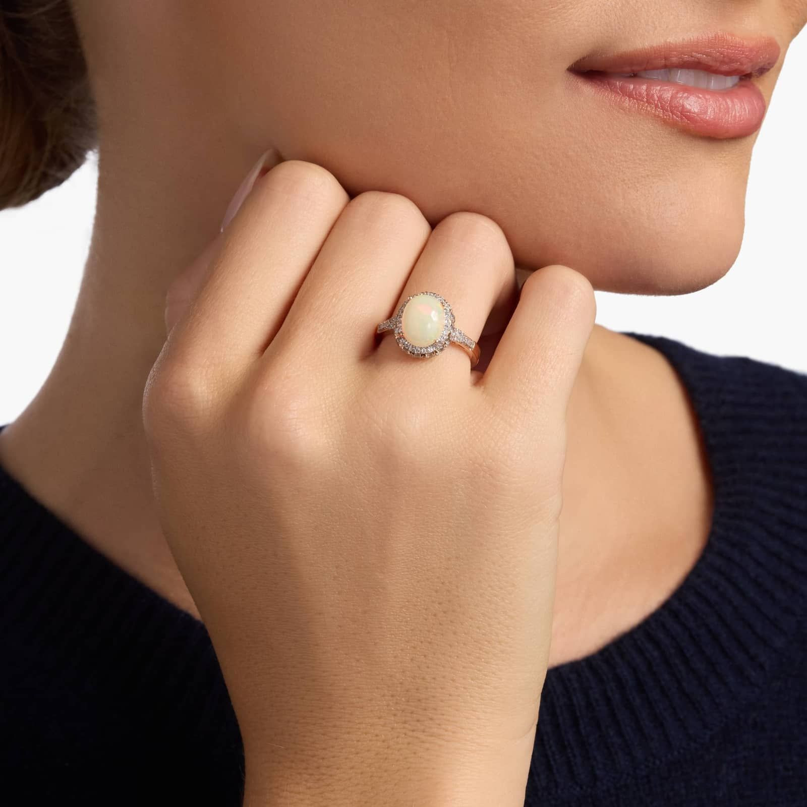 Oval Opal and Swiss Blue Topaz Halo Ring in 14k Rose Gold | Blue Nile