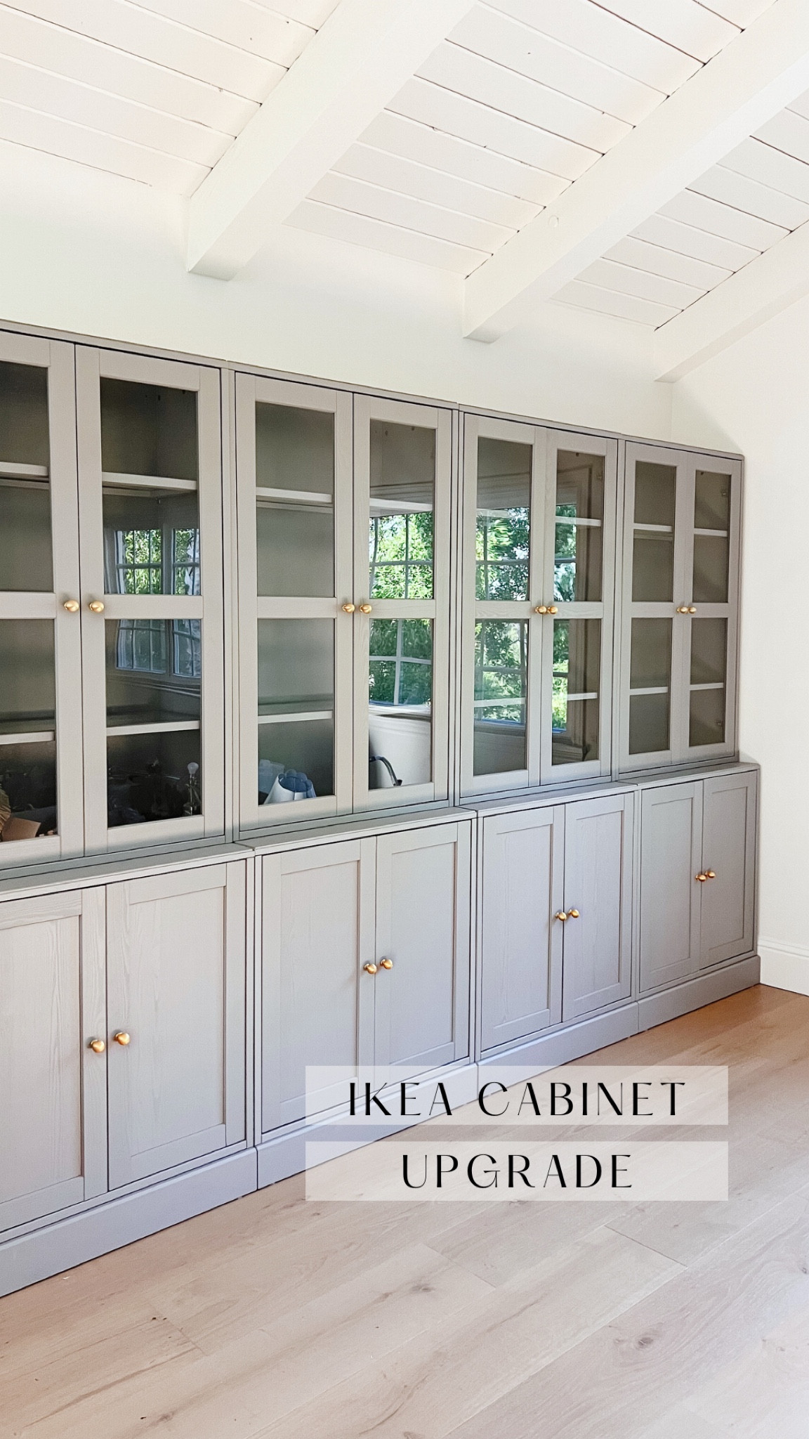 These are the IKEA HAVSTA cabinets and I swapped out the hardware for these weighty brass ball cabinet knobs that are so good!