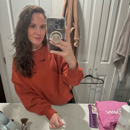 This #Nike #crewneck is on sale and even though I did not need another sweatshirt, I am in love with this burnt orange color! Runs more oversized / boxy, which I prefer. I got a small!🤎

#LTKover40 #LTKfindsunder100 #LTKfitness