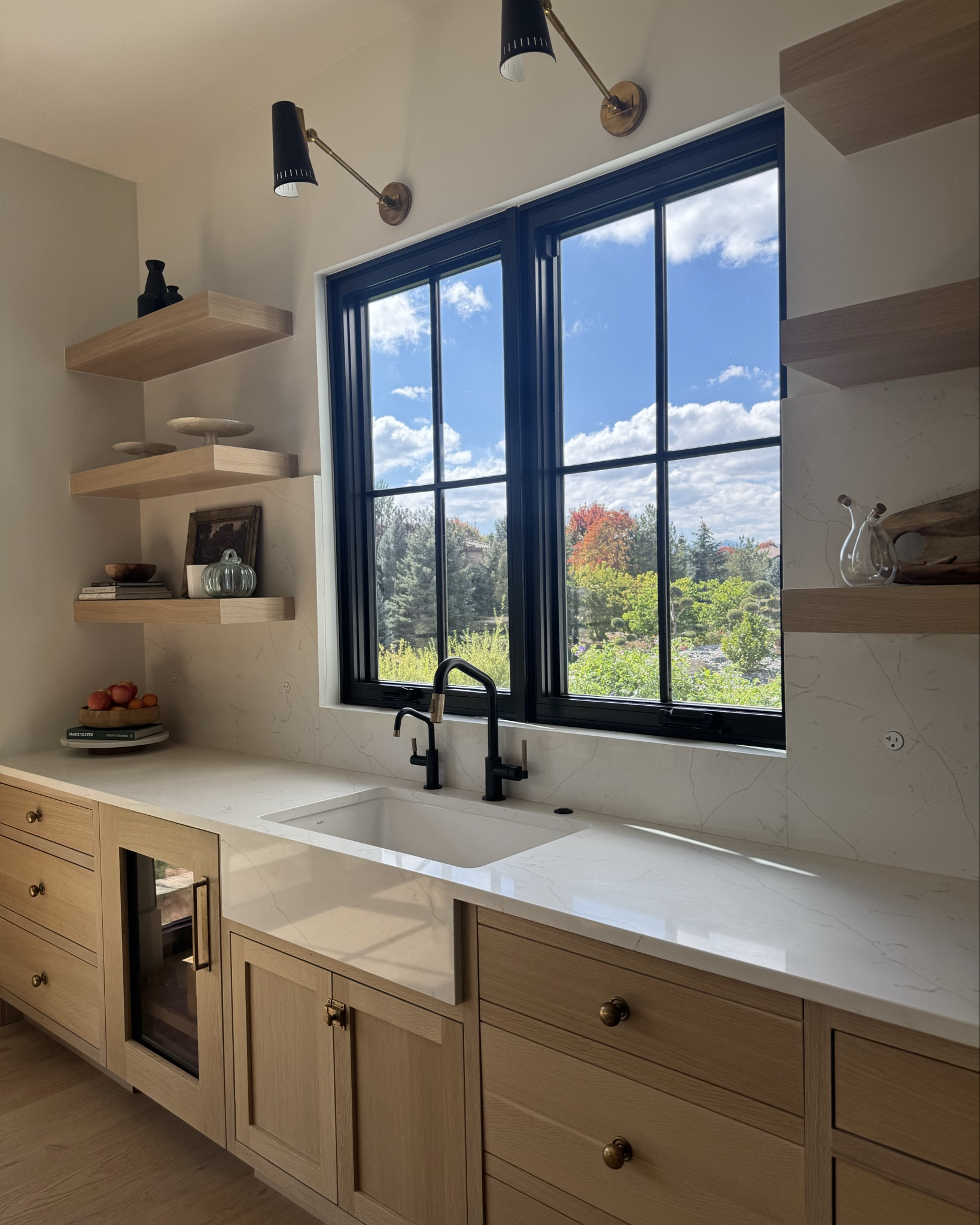 Dream Kitchen Vibes 🍽️✨
Step into the heart of our home—where beauty meets real life. 🤍🍳
This open-plan kitchen was designed for gathering, cooking, and hosting everyone we love:
• Open shelving to showcase my favorite dishware
• Iron + glass doors for a timeless architectural moment
• Two oversized islands—one for prep, one that seats up to 18 🥂
• A cozy dining nook with a one-of-a-kind table for family meals 🪑
• Chef-level appliances: (2) 36” fridge/freezers, a 48” range, and double dishwashers
• Statement sconces + layered lighting that glow day and night ✨
• Thick countertops, dual sinks, and thoughtful details designed for real function
Swipe through to see how it all comes together 🤍🔪

#LTKHome #LTKdayinmylife #LTKU