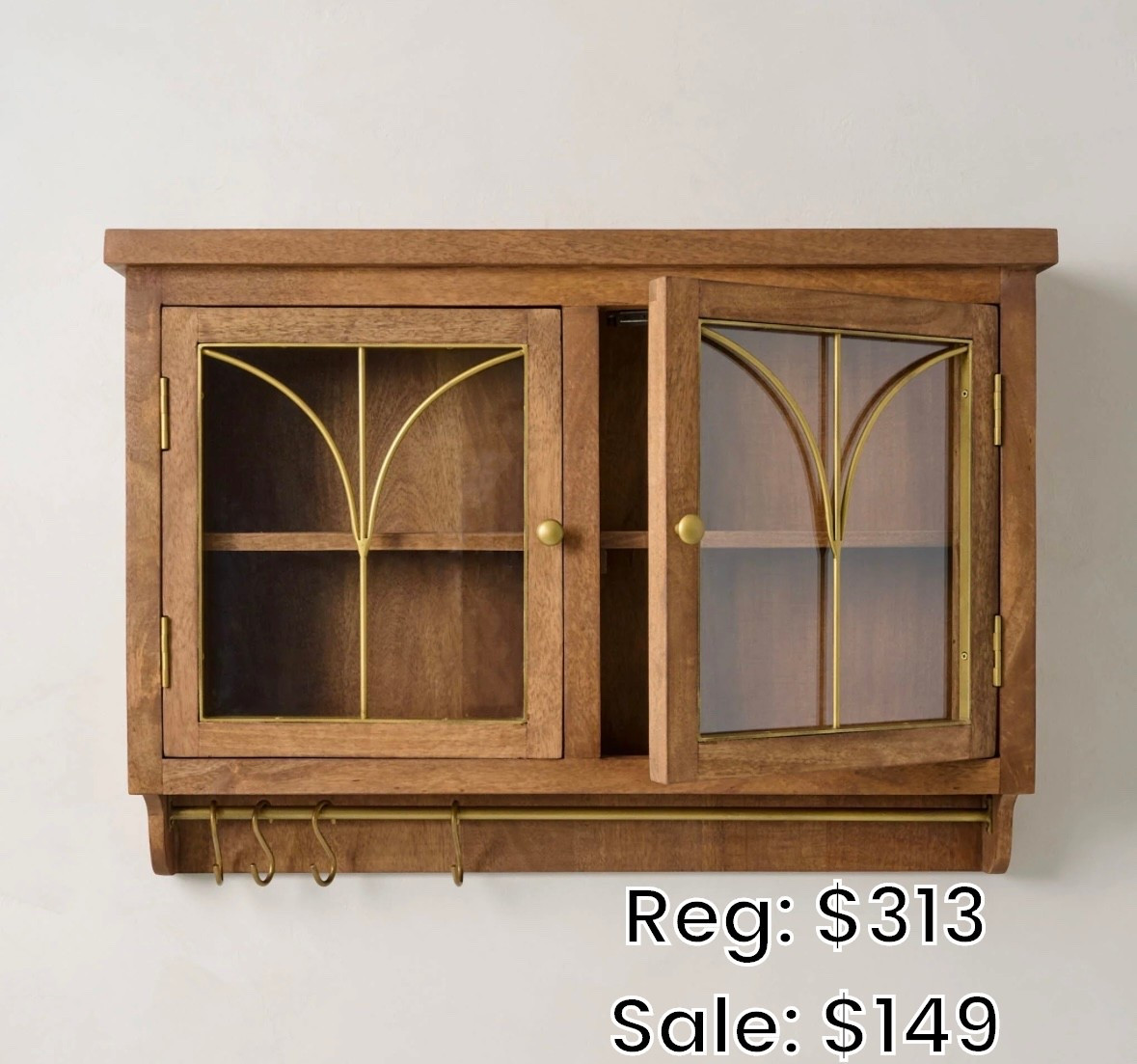 This gorgeous wooden wall display shelf is currently on sale. Love the detail on the glass doors. And, there are little hooks for hanging things on the bottomm

#LTKSaleAlert #LTKSeasonal #LTKHome