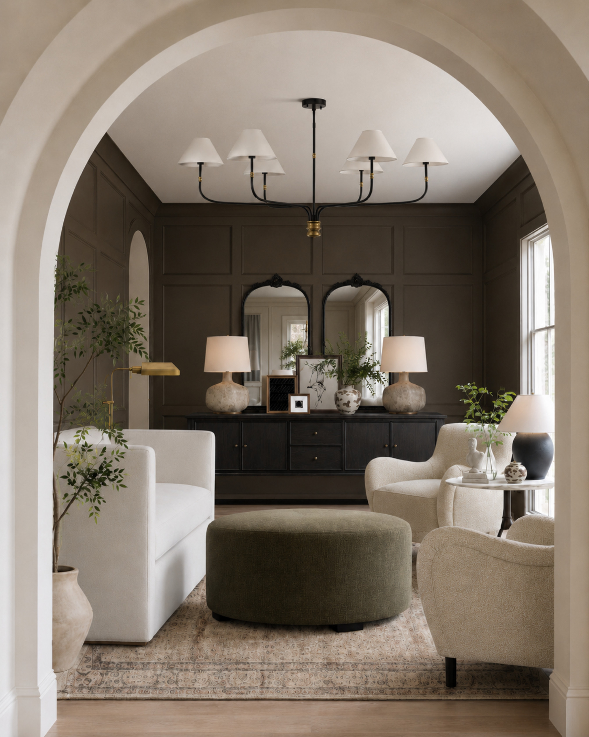 A classic neutral sitting room with so much warmth — olive brown walls, ivory upholstery, an oversized ottoman, patterned rug, dark wood storage, and black-framed mirrors for contrast. Perfect inspiration if you love traditional interiors, quiet luxury decor, layered neutrals, and a collected designer look.

I may receive a commission from purchases made through my links.

#LTKHome