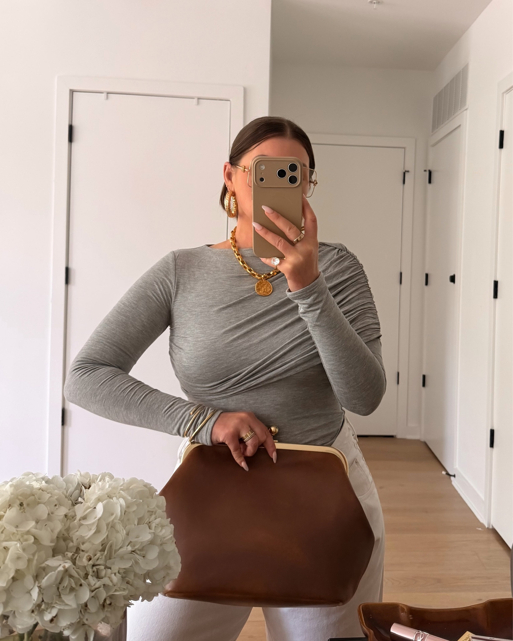 Jeans & a Top 🥰 but make it chic 😘 Comment GREY for outfit details sent to your inbox

When selecting “basics” I always look for a special detail that makes an item stand out. That stand out detail takes it from “every other B” to “oh my gosh, I love that! Where did you get it?”

For instance, we have jeans. I could have selected a basic pair of jeans but I went with these ultra wide leg fold over style. Not only does it have the cool effect but they’re so comfortable. Def feel like sweats, I have 3 washes and have worn them on long haul flights.

Similarly, the top gives exactly what the jeans do. The easy reach is a basic tee. However, we get the same fit but the shoulder draped detail makes this top a special stand out piece. … this top is double lined jersey, it’s weighty. The quality and fit connect with the price.

Ohhhhh I almost forgot this Coach Kisslock, we’ve been chatting about it in stories. It’s a medium “distressed” style. That gives a little of what the XL runway version gave but a size more suitable for every day. The shoulder strap does come off if you want the clutch vibe 

DON’T FORGET: for all outfit details you can go straight to my b!o this will be on the grid, just click. & as always it’s on my LTK. You don’t have to comment to get the info if you don’t want to 😉 bc same lol

https://liketk.it/6mroN