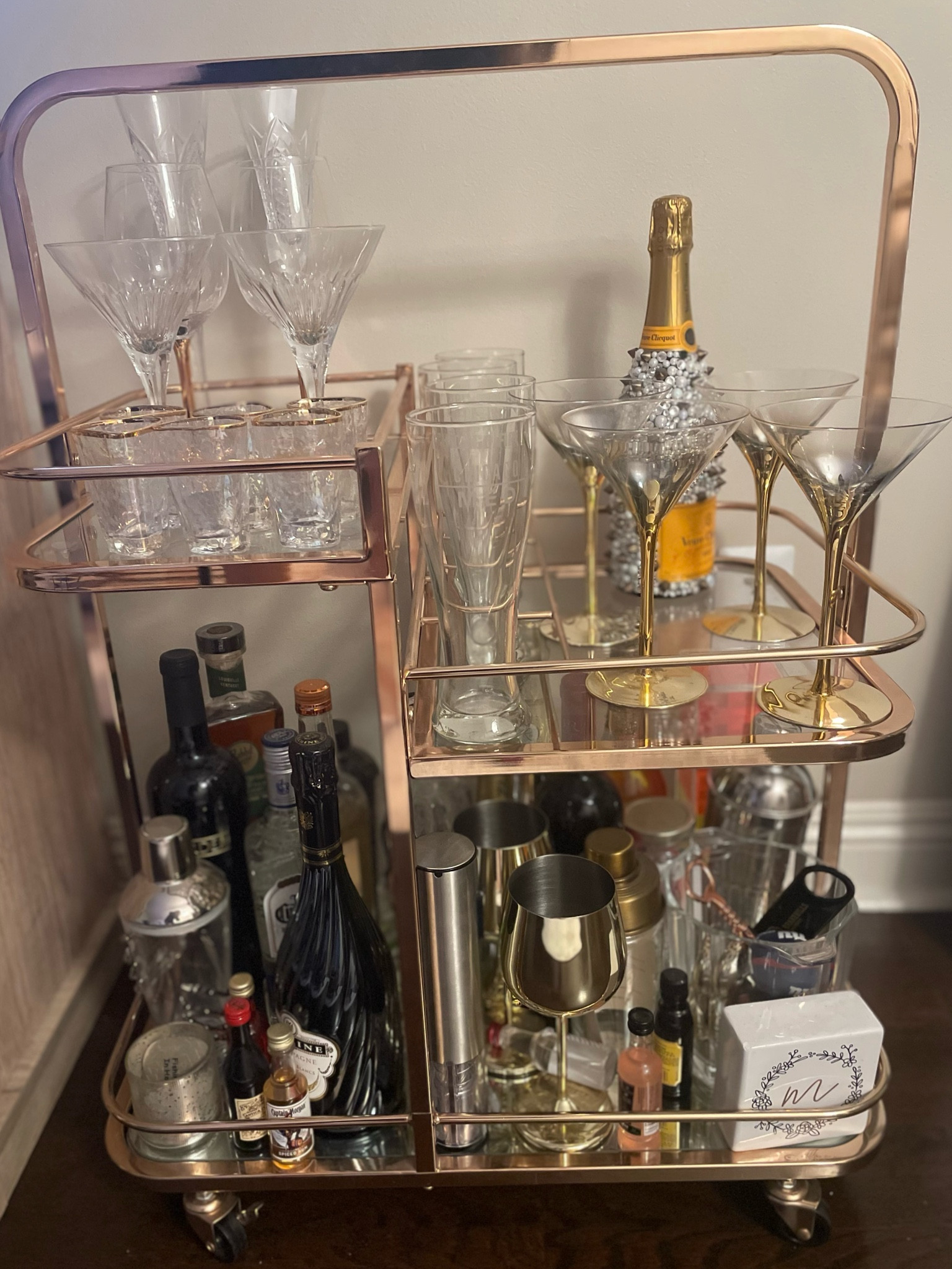 This bar cart is the best conversation starter — and one of my favorite pieces. I love the rose gold + my gorgeous glasses and decor. Waterford champagne flutes & martini glasses were NYE limited edition but shared the closest ones!

#LTKparties #LTKhome