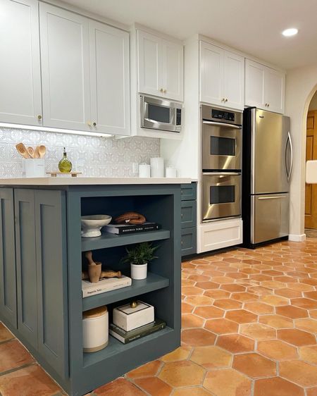 This lakehouse kitchen was majorly lacking in #AustinVibes before we renovated. But by bringing in clay tile, a great backsplash and gorgeous color - it now has a whole new personality. 
#WoodlandsStyleHouse

#LTKhome #LTKstyletip