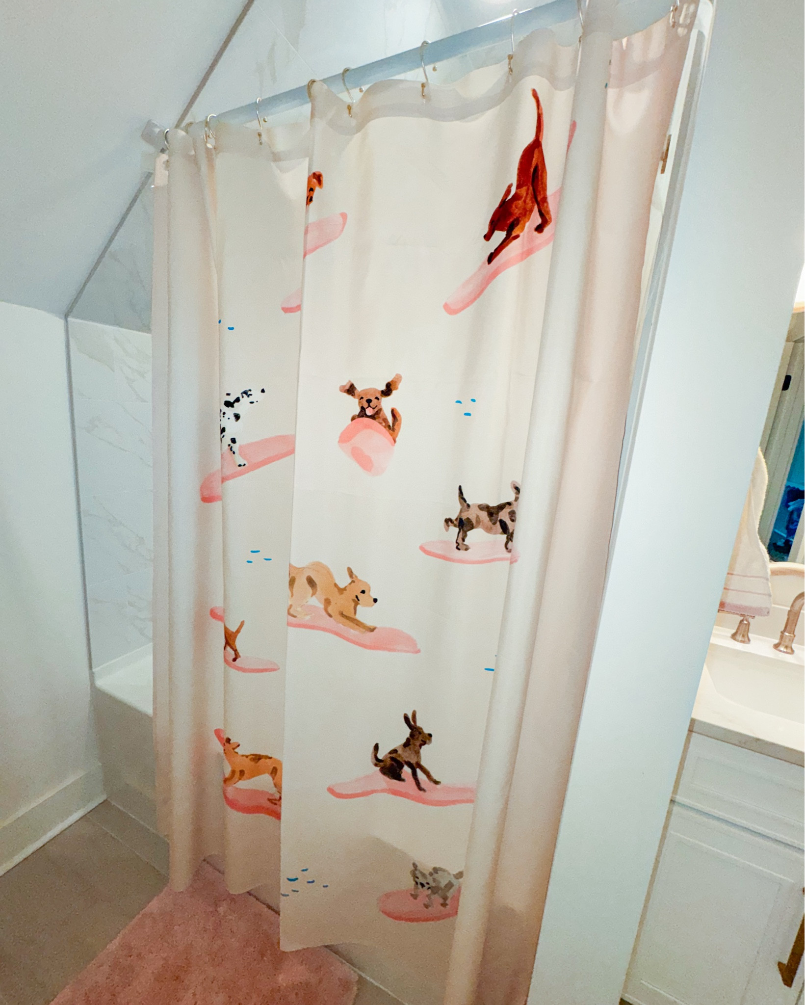The cutest shower curtain from Urban Outfitters with dogs surfing on it for my little girls bathroom 

#kidsbathroom #bathroomdecor #coastaldecor #beachy 

#LTKKids #LTKHome #LTKSaleAlert