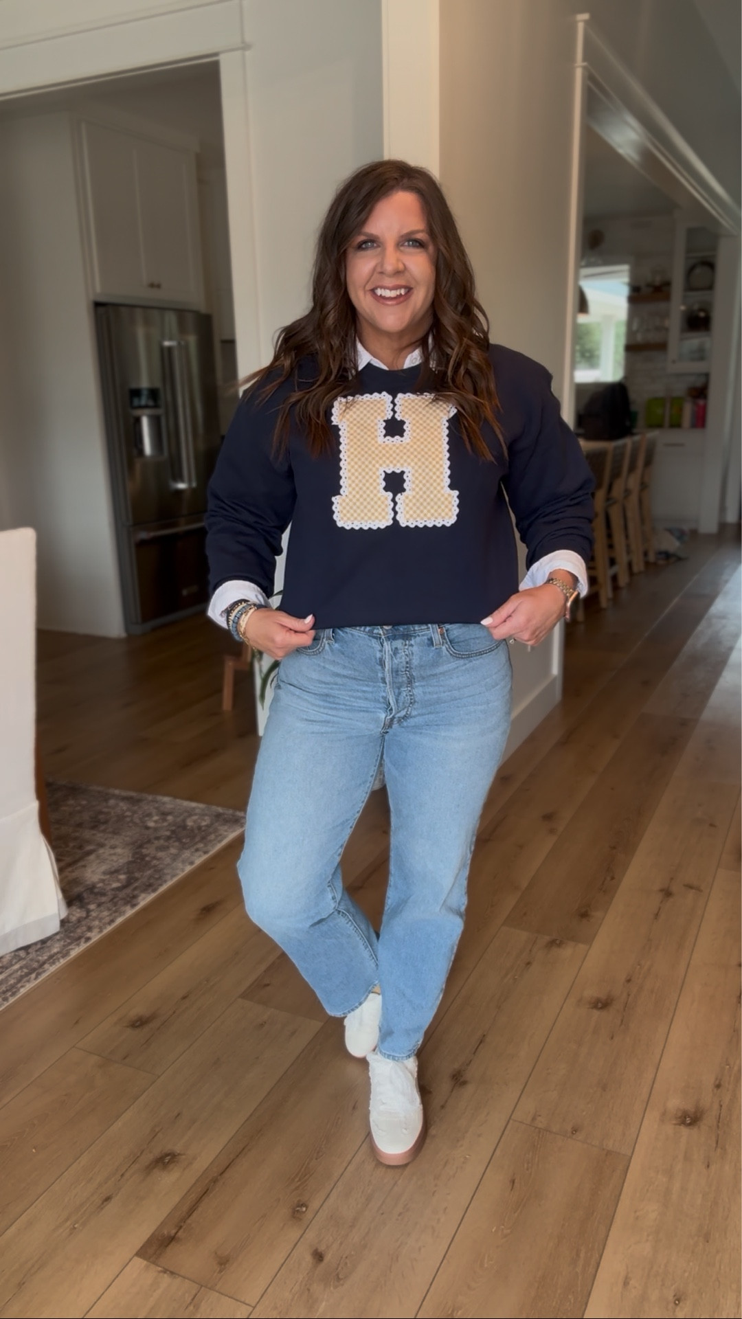An embroidered gingham, eyelet team sweatshirt, i mean have you seen anything cuter! Of course paired with my Levi’s and lace sneakers. 

Gameday outfit, gingham, eyelet, Levi, neutral sneakers, lace sneakers 

#LTKootd #LTKOver40 #LTKmomlife