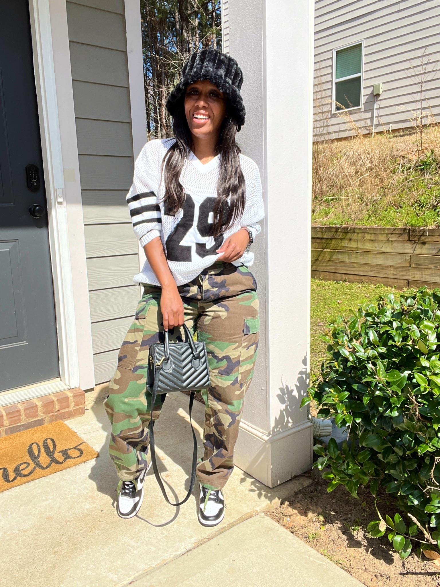 Camo pants with crochet sweater jersey with black fluffy bucket hat, black purse, and Nike dunk high sneakers

#LTKFindsUnder50 #LTKPetite #LTKStyleTip