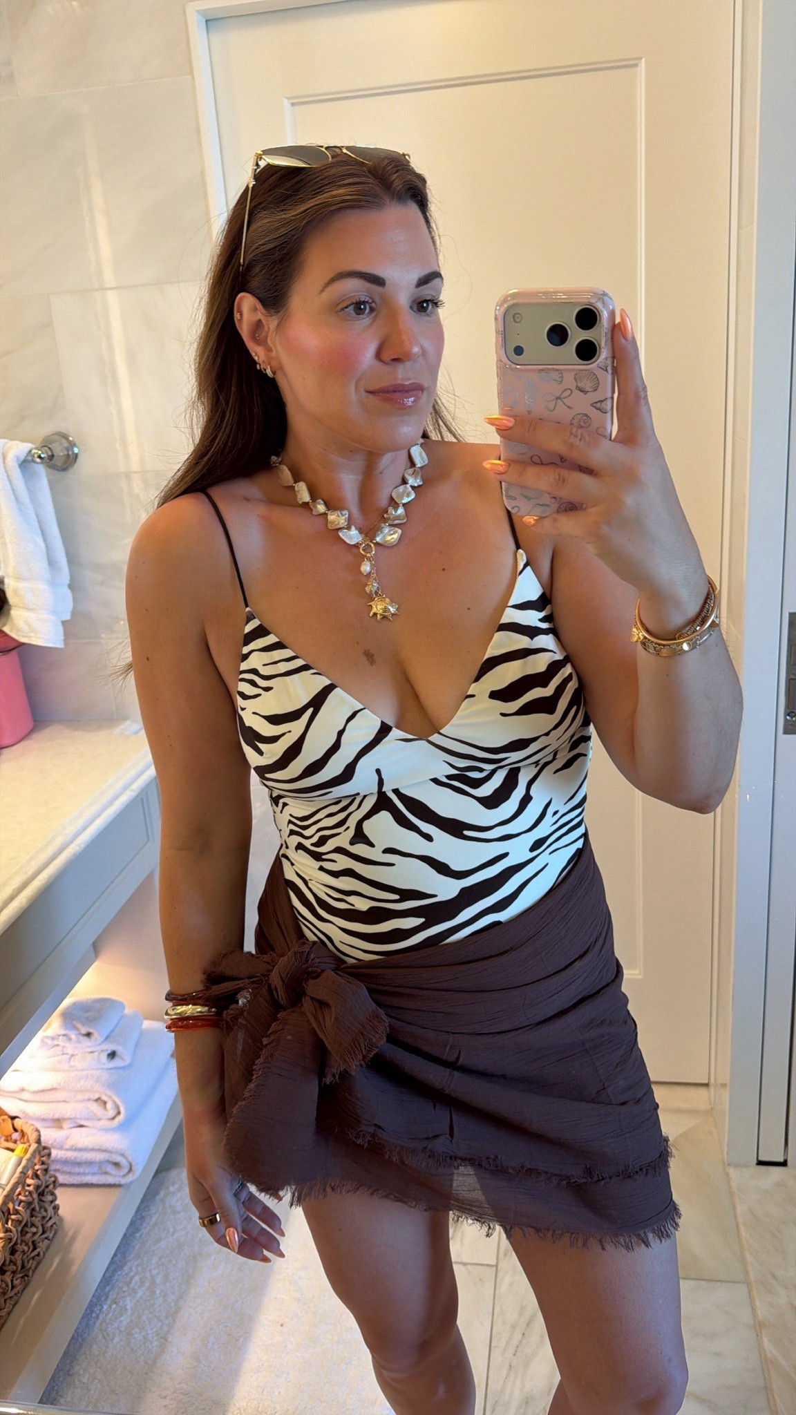 curvy midsize chocolate brown zebra swim look! wearing size large in swimsuit and i folded the sarong in half to make it shorter 🤎

#LTKMidsize #LTKSwim #LTKTravel
