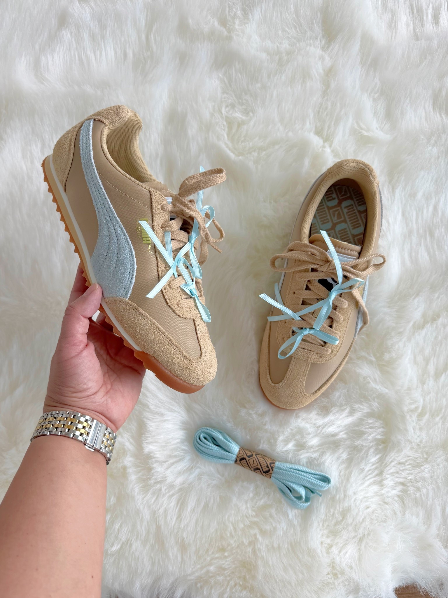 Aren’t these new Puma sneakers with these little blue bows so cute?! Love the neutral colors, low profile and cute little details. They come with these pretty light blue laces too! True to size. 

#LTKActive #LTKootd #LTKTravel