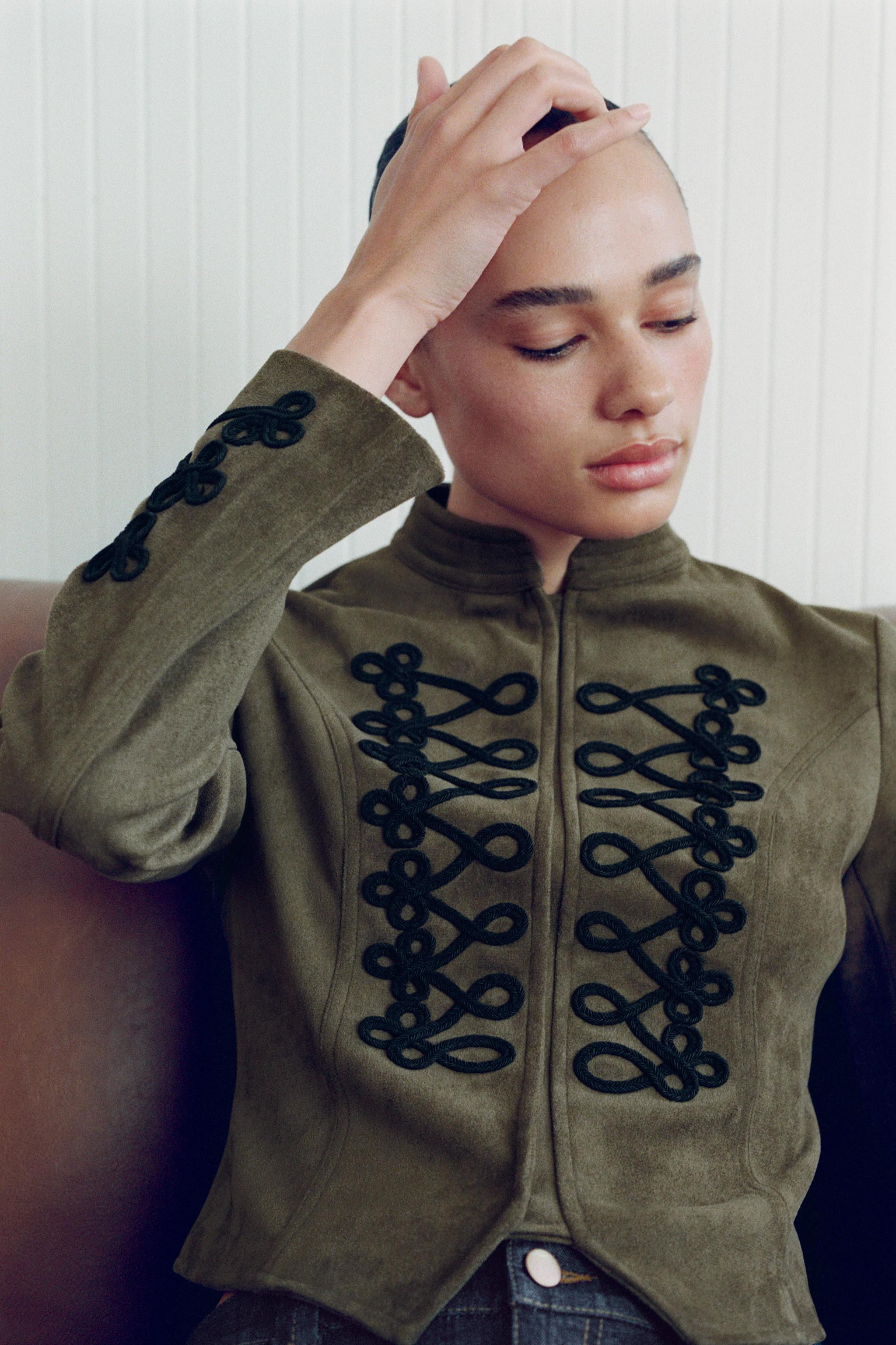High-collar jacket with long sleeves. Featuring contrasting frog fastening detail. Asymmetric hem... | Zara US