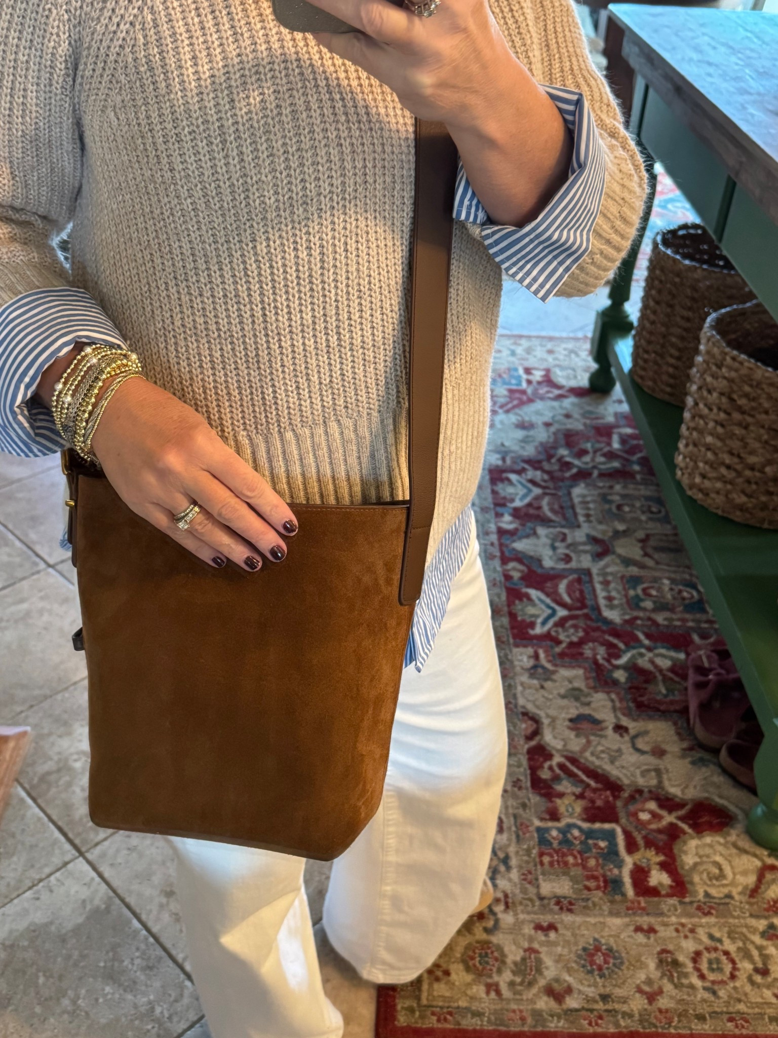 A follower fav!! This suede crossbody is so good. I get so many compliments on it. It has an adjustable strap, gold hardware on bottom to keep it scuff free, and it’s the perfect size. It has a strap on the inside to hold my keys, so no more fumbling around to find them. It also has an inner zipper pocket and holds all of the necessities without being too big and bulky. 

#LTKHome #LTKOver40 #LTKSaleAlert