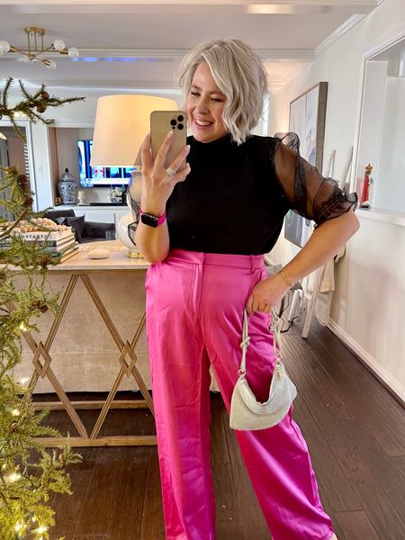 Code WANDA10
Black top with clear puffy sleeves. 
Hot pink satin pants 
Hot pink shoes 
Amazon sparkle bag 

#LTKSeasonal #LTKunder100 #LTKHoliday