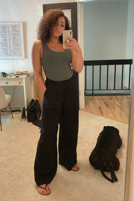 My favorite wide leg linen pants from Target! Easy to pair with a bodysuit and sandals for summer ☀️

#LTKstyletip #LTKunder50