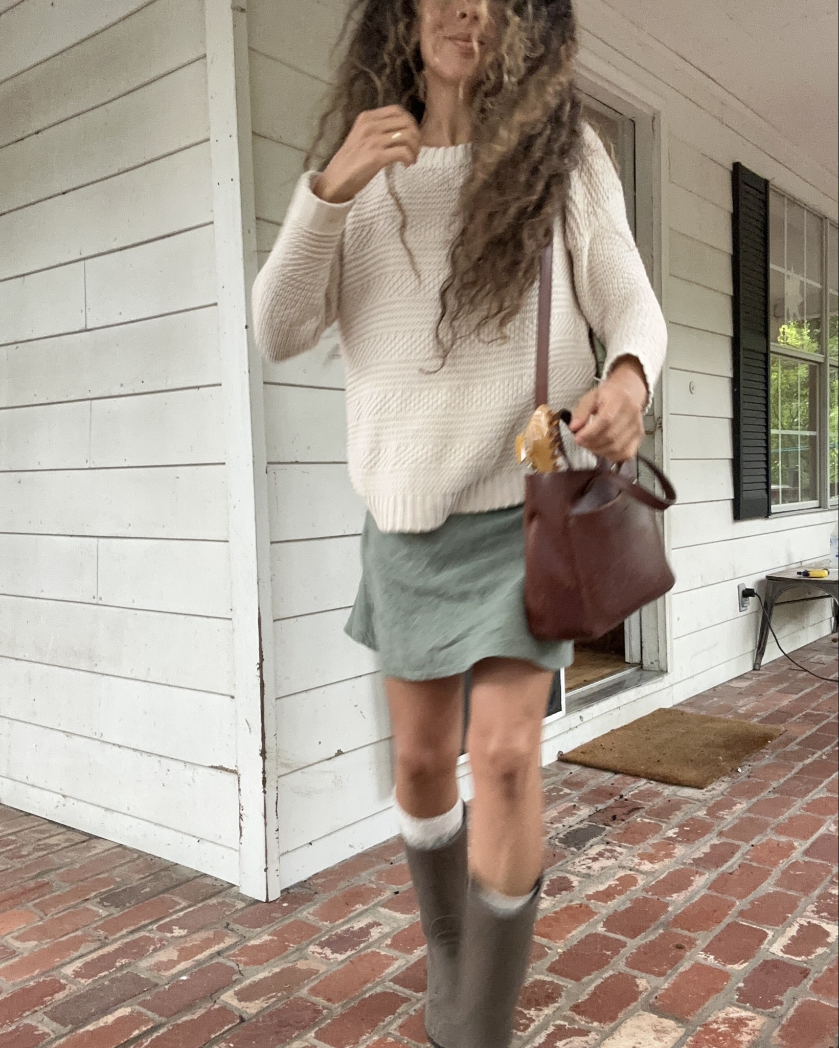 Fall Outfit 🍂 
Little skirt, big sweater, and rain boots 🙌🏽

#LTKStyleTip #LTKFindsUnder100 #LTKOver40