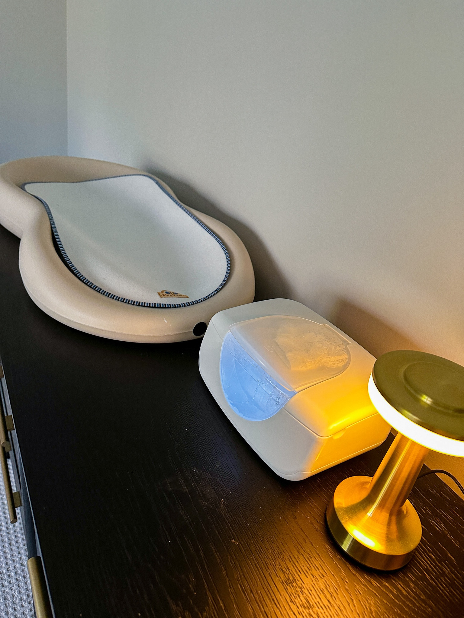 Changing table essentials! The Keekaroo makes any accidents super easy to clean up and the wipe warmer makes diaper changes a little less jarring for newborns (and mom, tbh). The portable lamp is the perfect gentle light for middle of the night changes - it’s an amazon find! 

#LTKbaby #LTKhome