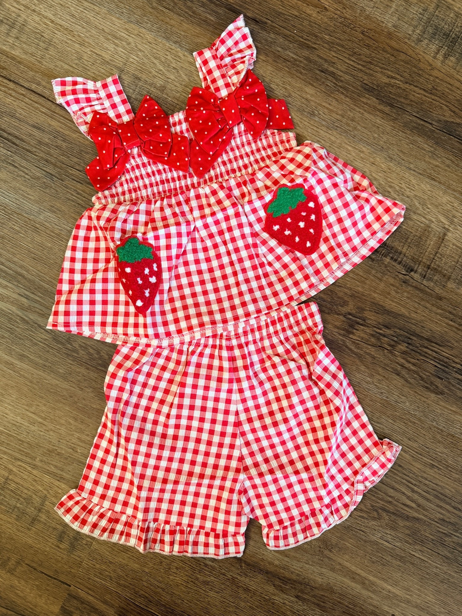 Sweet summertime style 🍓❤️ This adorable red gingham two-piece toddler outfit features a ruffle strap tank top with cute strawberry appliqués and matching ruffle shorts — the perfect boutique baby girl outfit for summer, picnics, birthdays, vacations, and everyday play. A must-have strawberry outfit for toddlers, baby girls, and little fashionistas! 

#ToddlerFashion #BabyGirlClothes #StrawberryOutfit #GinghamOutfit #BoutiqueKidsFashion #SummerToddlerStyle #BabyBoutique #ToddlerOutfit #GirlsSummerOutfit #StrawberryPrint #ToddlerStyle #BabyFashion #KidsBoutiqueClothing #MatchingSet #LittleGirlStyle 

 #LTKBaby #LTKKids