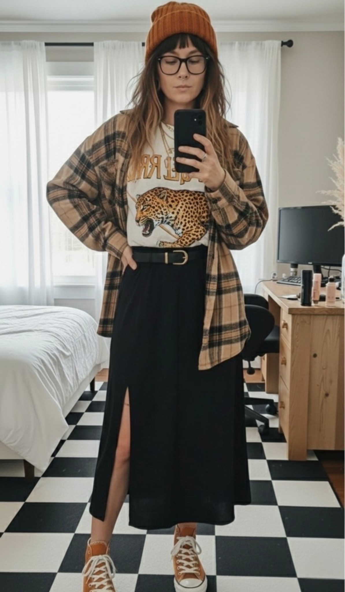 about that effortless, "stolen from the guys" vibe balanced with a sleek midi. This oversized neutral flannel is the perfect weight for spring layering, and I’m obsessed with how it pairs with this graphic leopard tee.
The black side-slit midi skirt adds just enough edge while keeping it comfortable. Finished the look with my go-to burnt orange high-tops and a matching beanie to tie the warm tones together.

#LTKSeasonal #LTKmomlife #LTKootd