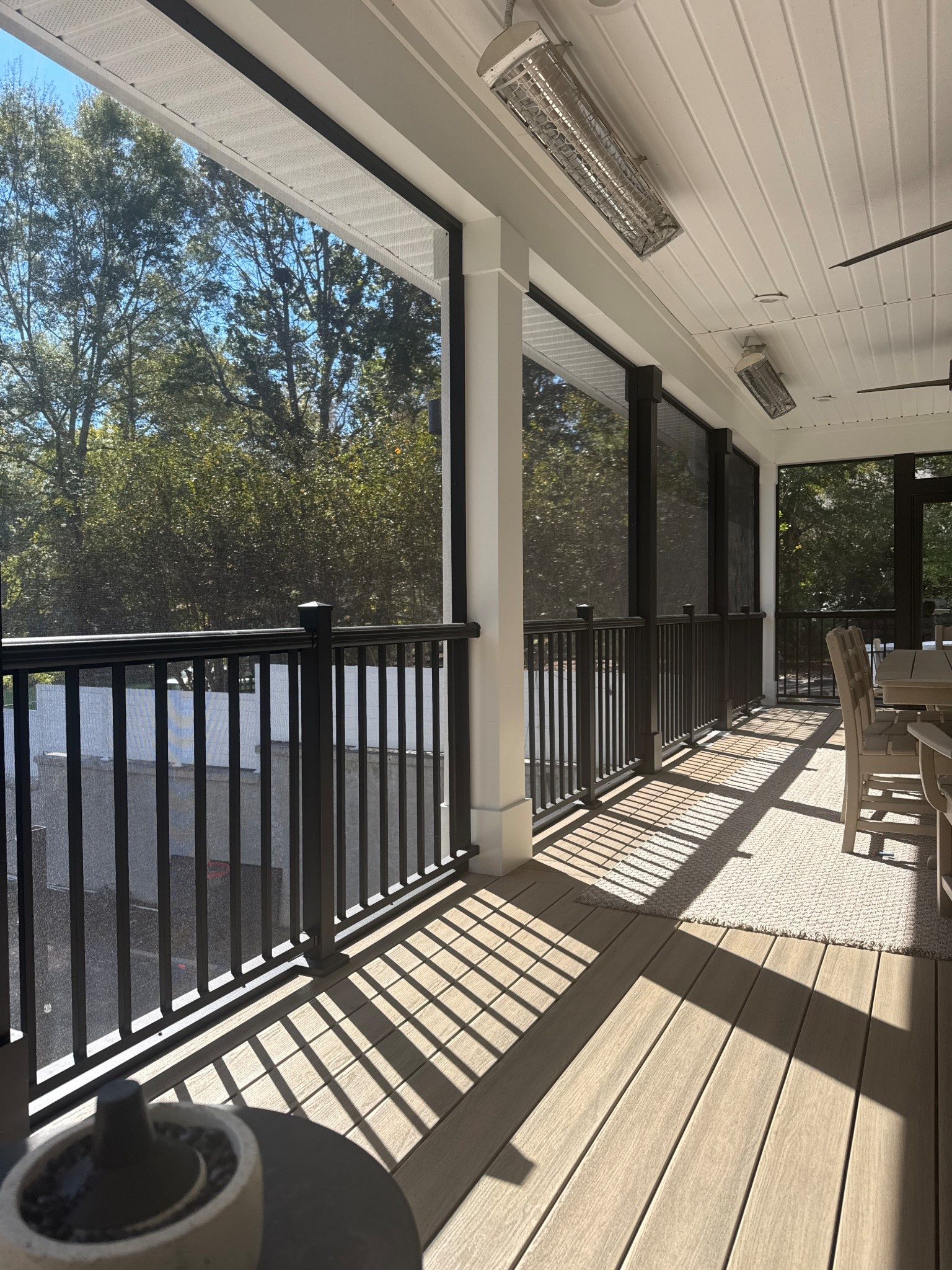 The dreamiest screened in porch there ever was ❤️. Heaters are essential so we can use this all year long!