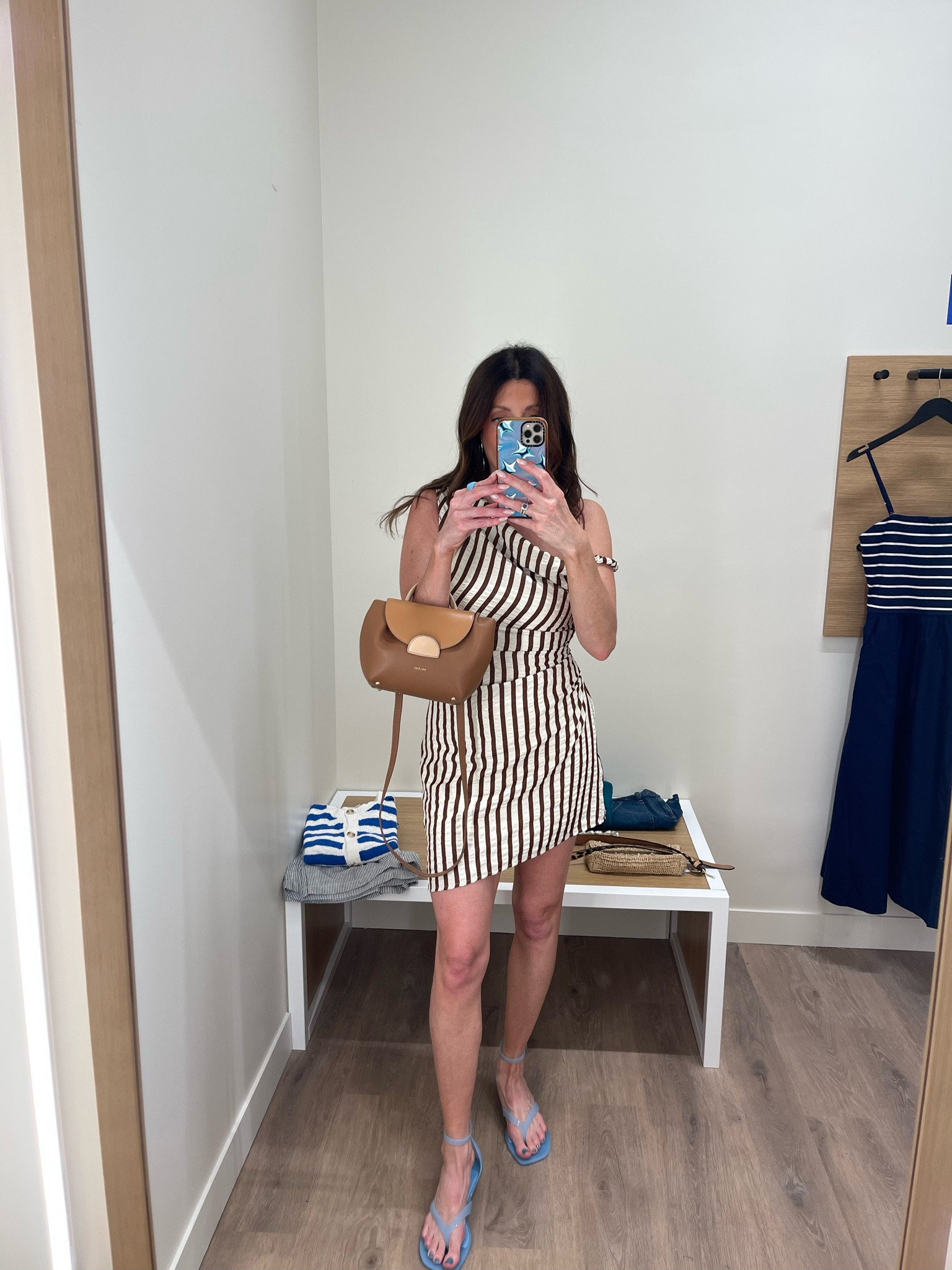 The perfect summer dress under $50!! I love the off the shoulder detail. This is one to pack for any trip when you want a day to night look! It is brown and white striped with a texture that makes it forgiving. Wearing size smalll

#LTKootd #LTKdayinmylife #LTKgrwm
